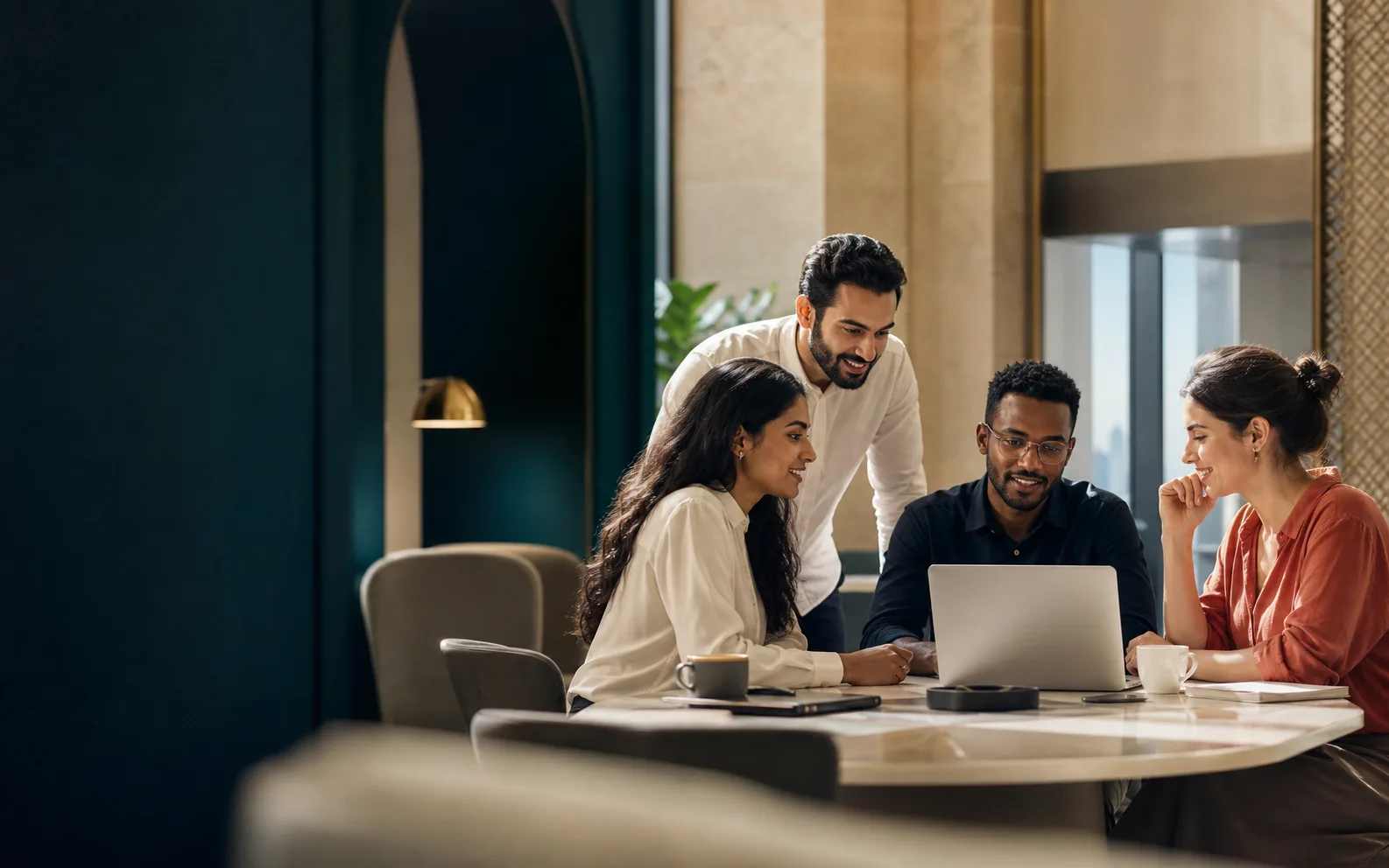 Professionals collaborating in a contemporary Gulf workplace